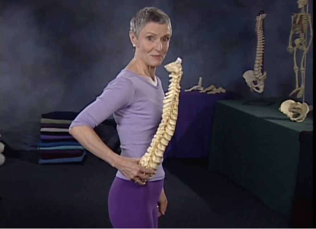 Jean Couch holding a spine