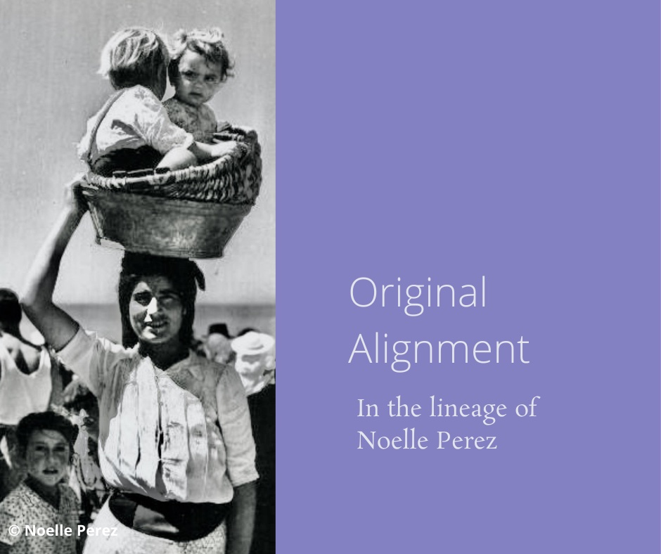 woman in original alignment carrying babies on her head